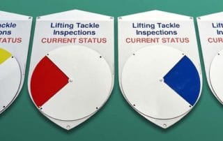 Colour coded locking status indicator dial shield